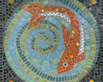 Glass mosaic panel of a goldfish swimming through reeds