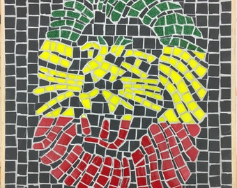 The Lion of Judah glass and ceramic wall mosaic wall panel in the red green and gold colours of the Rastafarians