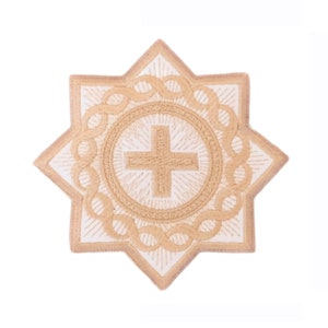 May include: An embroidered patch in the shape of an eight-pointed star. The patch features a cross in the center, surrounded by a circular design and a decorative border. The colors are beige and white.