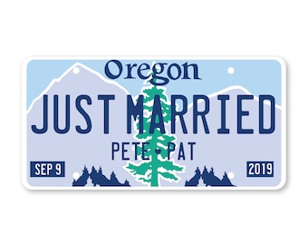 May include: A blue and white Oregon licence plate with the text "JUST MARRIED" and the names "Pete & Pat" below. The plate also includes the date "SEP 9" and the year "2019".