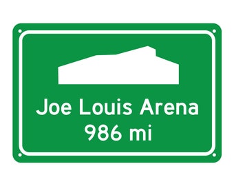 May include: Green road sign with white text and a white silhouette of a building. The sign reads "Joe Louis Arena 986 mi".