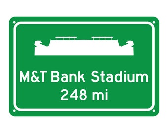 May include: Green road sign with a white silhouette of a stadium and the text "M&T Bank Stadium 248 mi".