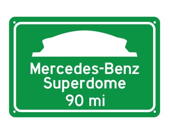 May include: Green road sign with a white silhouette of a domed stadium. The sign reads "Mercedes-Benz Superdome 90 mi".