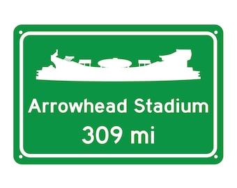 May include: Green road sign with white text and a silhouette of Arrowhead Stadium. The sign reads "Arrowhead Stadium 309 mi".