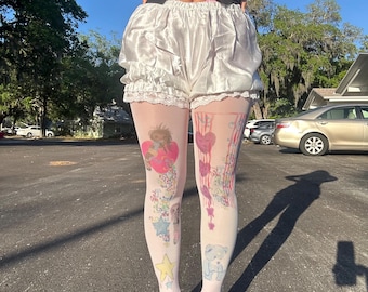 Kidcore kawaii music notes graphic baby pink, blue, purple, yellow and green graphic tights