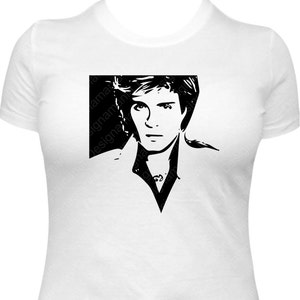 May include: Black and white silhouette of a man with long hair wearing a collared shirt. The image is on a white t-shirt.