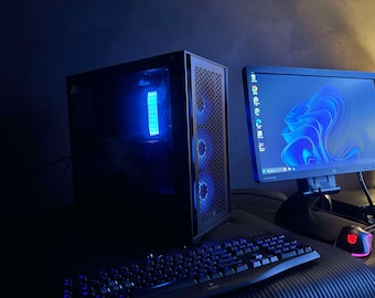 PC para juegos Ryzen 9-9900X: RTX 4060, 32 GB de RAM, SSD M.2 de 2 TB, compatible con seis monitores.