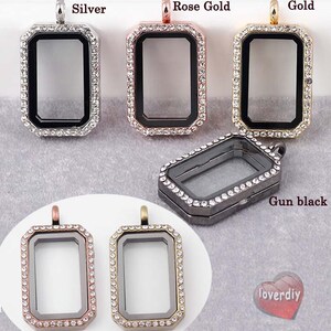 May include: Assortment of 10 silver, gold, rose gold, red bronze, antique bronze, and gun black locket pendants with clear glass inserts and a clear rhinestone border.