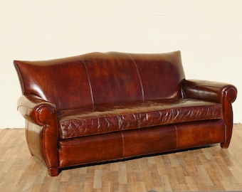 Vintage Art Deco Distressed Brown Leather Three-Seat Sofa With Mustache Back