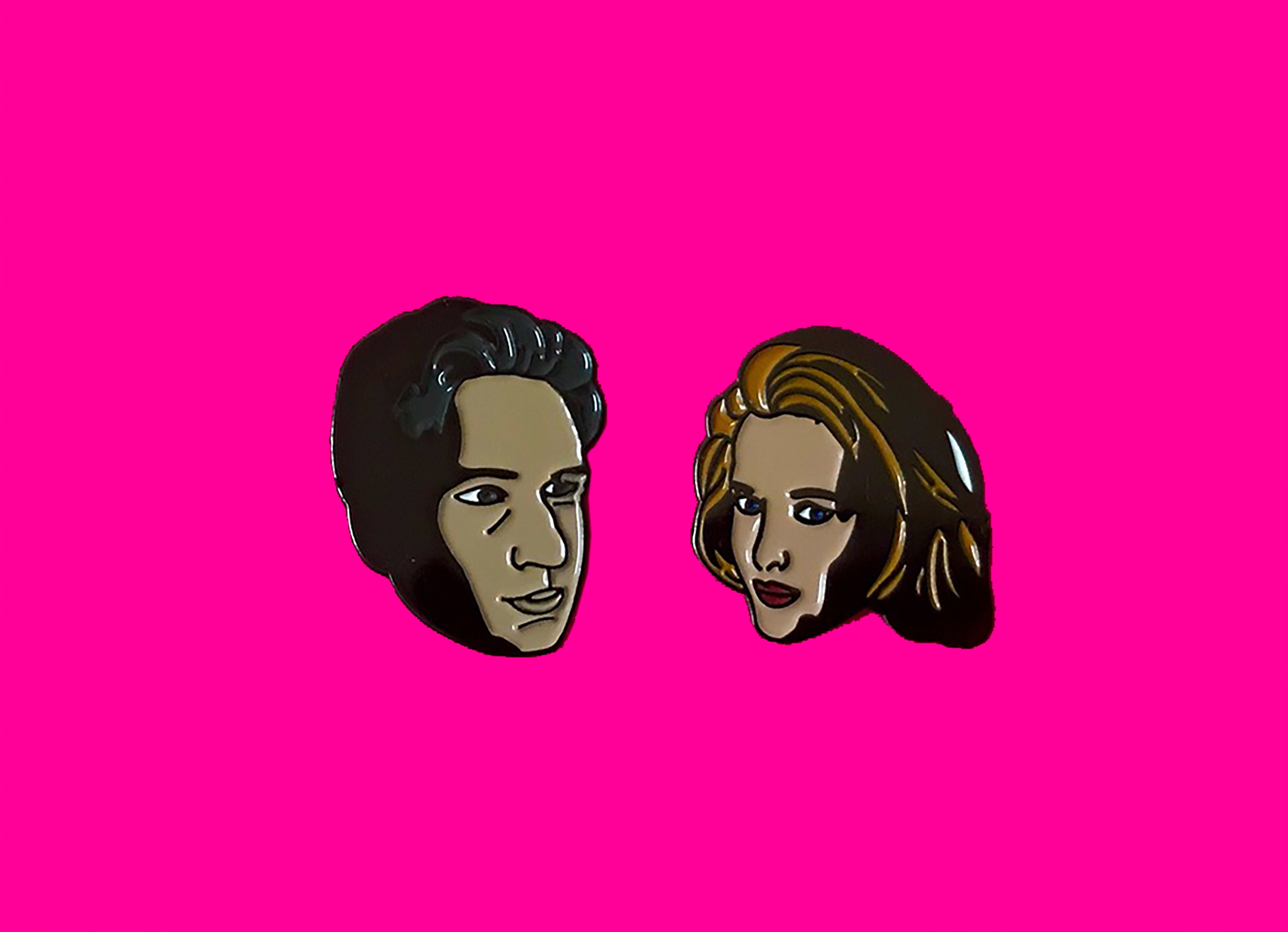 X-Files enamel pin featuring Mulder & Scully.