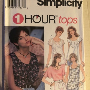 May include: Simplicity sewing pattern number 8986 for 1 Hour Tops. The pattern includes five different tops with various necklines, sleeve lengths, and styles. The tops are shown on models with different hairstyles and accessories.