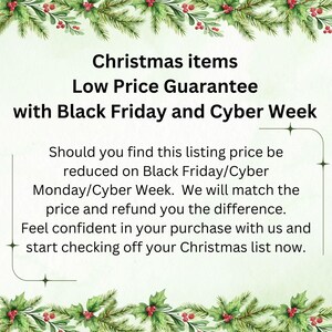 May include: A promotional image with text that reads "Christmas items" and "Low Price Guarantee with Black Friday and Cyber Week." The image is framed with green pine branches and red berries.