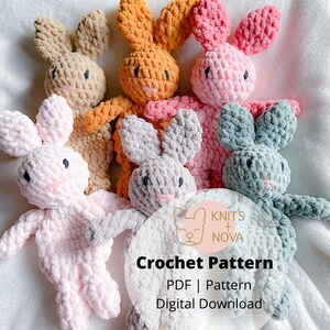 May include: A collection of handmade crochet bunnies in various pastel colors, including pink, orange, gray, and blue. Each bunny has long ears, a small pink nose, and a smiling face. The image also includes the text "Knits + Nova" and "Crochet Pattern".