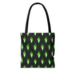 May include: A black tote bag featuring a repeating pattern of bright green, diamond-shaped plumbob icons. The bag has two sturdy black shoulder straps attached to the top edge, providing a consistent design across the front surface of the fabric.