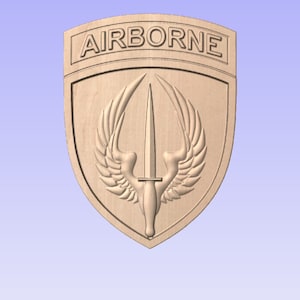 May include: A wooden shield-shaped plaque with the word "AIRBORNE" at the top and a stylized image of a winged dagger in the center.