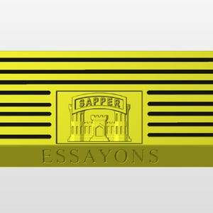 May include: A yellow metal plaque with the words "SAPPER" and "ESSAYONS" in black lettering. The plaque features a stylized image of a fort with a gate and a tower.