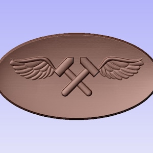 May include: A brown oval-shaped metal pin with a pair of crossed hammers and a pair of wings.