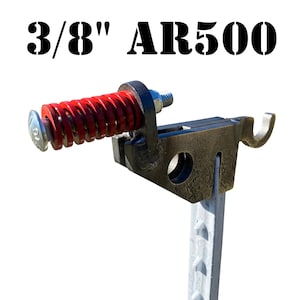 May include: A 3/8" AR500 steel target with a red spring and a metal hook. The target is mounted on a metal post.