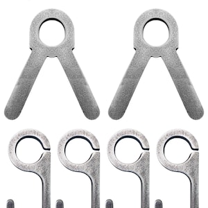 May include: Two silver metal hooks with a 3/8" diameter opening and a 3/8" AR500 label. The hooks are designed to be used for hanging items.
