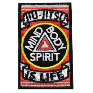 May include: A rectangular embroidered patch featuring a red and white striped background. It displays the text JIU-JITSU at the top and IS LIFE at the bottom. A central black circle contains a triangle with the words MIND, BODY, and SPIRIT.