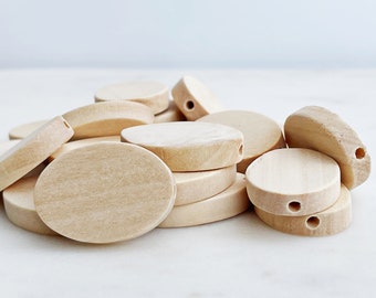 24mm x 17mm OVAL WOOD BEADS (0.94 Inch).  Unfinished with a 2mm Hole. Natural Wood oval bead in packs of 10, 20, & 40.