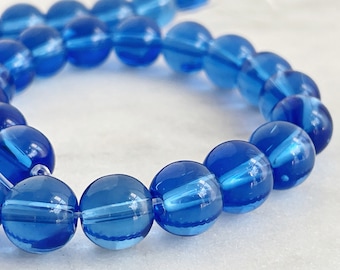 32 Pieces of 10mm Round Medium Blue Transparent Glass Beads