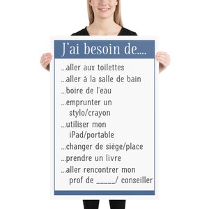 Peut inclure: Une affiche bleue et blanche avec le texte "J'ai besoin de..." et une liste de phrases en français, notamment "aller aux toilettes", "aller à la salle de bain", "boire de l'eau", "emprunter un stylo/crayon", "utiliser mon iPad/portable", "changer de siège/place", "prendre un livre", "aller rencontrer mon prof de _____/ conseiller".