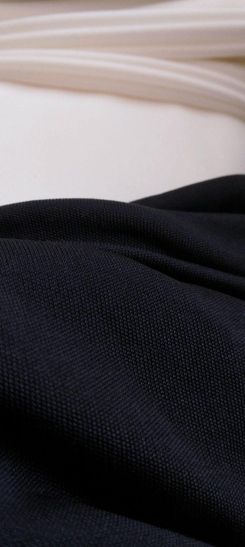 your choice of black or white solid colors of silk