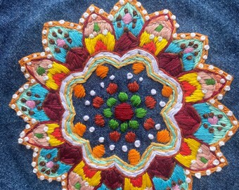 Freehand Embroidered Mandala on denim ready to attach to bag or clothing, frame to display etc. Mandala is on upcycled denim with raw edges.