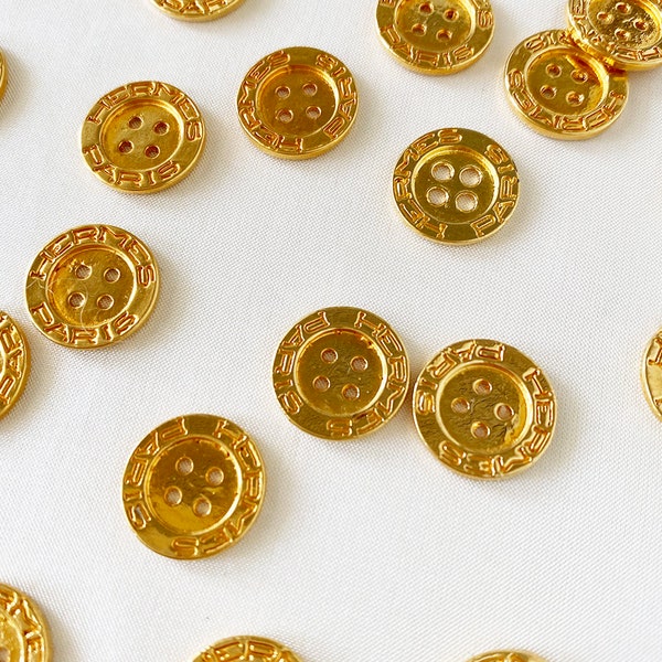 HERMÈS PARIS vintage goldplated gold buttons (price per button) 27 pieces in stock boutons 1.3 x 1.3 cm.