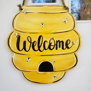 Beehive door hang