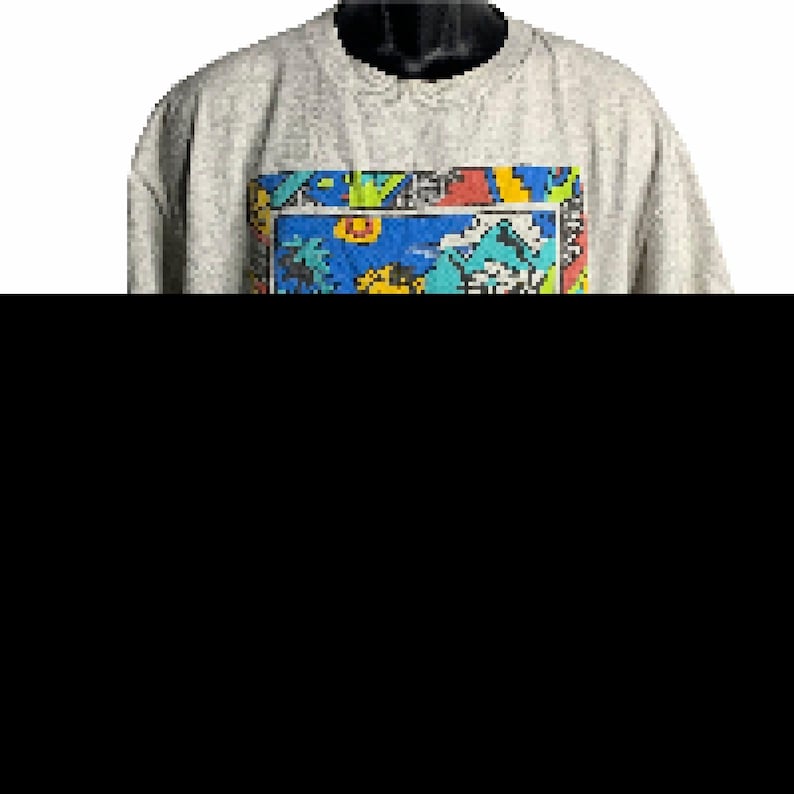Pode incluir: Uma camisa de moletom cinza com uma estampa gr&aacute;fica colorida na frente. O gr&aacute;fico apresenta uma variedade de formas e cores, incluindo azul, amarelo, verde, vermelho e preto.