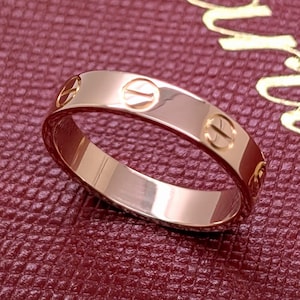 Size 5 CARTIER Love Band in 18kt Rose Pink Gold Ring comes with the Original Red Box + Service Confirmation from Cartier Boutique