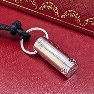 Classic CARTIER LOVE Screwdriver Pendant in 18kt White Gold with Paris Certificate of Authenticity and Red Necklace Box.