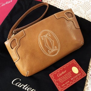 Porte-monnaie CARTIER, collection Marcello, pochette en cuir avec certificat d'authenticité d'origine + sac de rangement noir + boîte