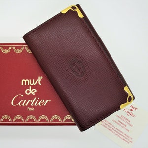 Classic CARTIER Key Case for 6 Keys in Burgundy Cowhide with Gilt Decor has Inside Credit Card Pocket comes with Original Tag and Red Box