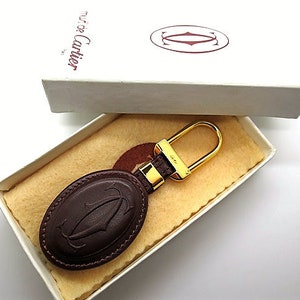 CARTIER KEY CHAIN, Burgundy Cowhide w Golden Appointments & Cartier Box, Cartier Key Fob, Leather Goods, Wallets, Handbags, Must de Cartier image 1