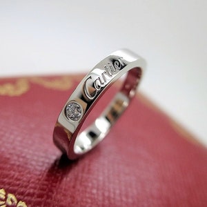 CARTIER WEDDING Ring, Size 50 (5.5 US), "C de Cartier", Platinum & Diamond, Cartier Box + Certificate, Cartier B4051300, Cartier B4051350 image 1