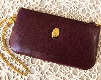 Classic CARTIER Pouch Handbag in Medium Size crafted of Burgundy Cowhide with Zip Closure & Wrist Chain includes Certificate of Authenticity