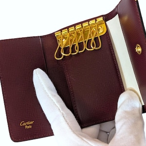 Classic CARTIER Key Case or Key Chain Wallet for 6 Keys in Burgundy Cowhide with Gilt Decor has Inside Credit Card Pocket incl Tag + Red Box