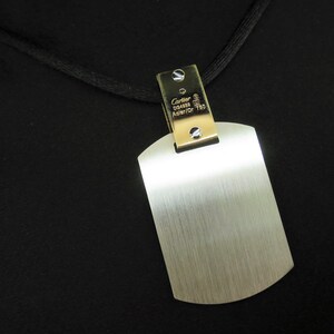 Up close image showing Cartier hallmarks and perfect like new condition of pendant.