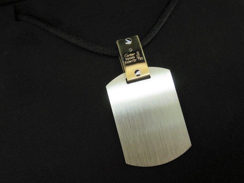 Up close image showing Cartier hallmarks and perfect like new condition of pendant.