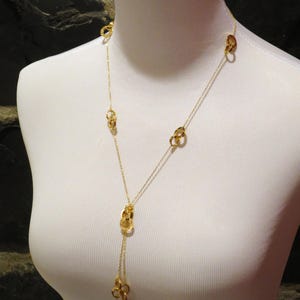 CARTIER LOVE NECKLACE Sautoir style in 18kt Yellow Gold comes with the original Cartier Certificate of Authenticity and the luxury Red Box