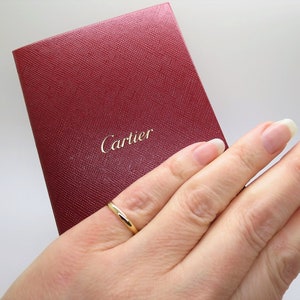 CARTIER 1895 WEDDING RING Size 48 (4.5 to 4.75US) 18kt Yellow Gold Band 2.5mm wide Cartier model CRB4002300 with Certificate of Authenticity