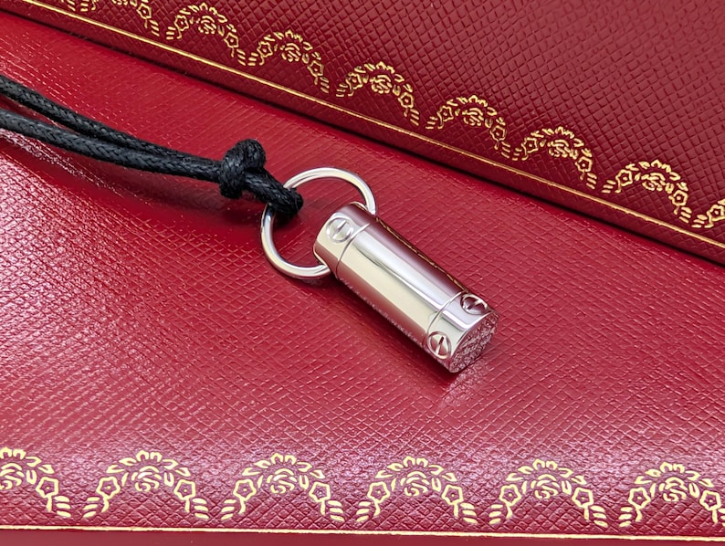 Classic CARTIER LOVE Screwdriver Pendant in 18kt White Gold with Paris Certificate of Authenticity and Red Necklace Box.