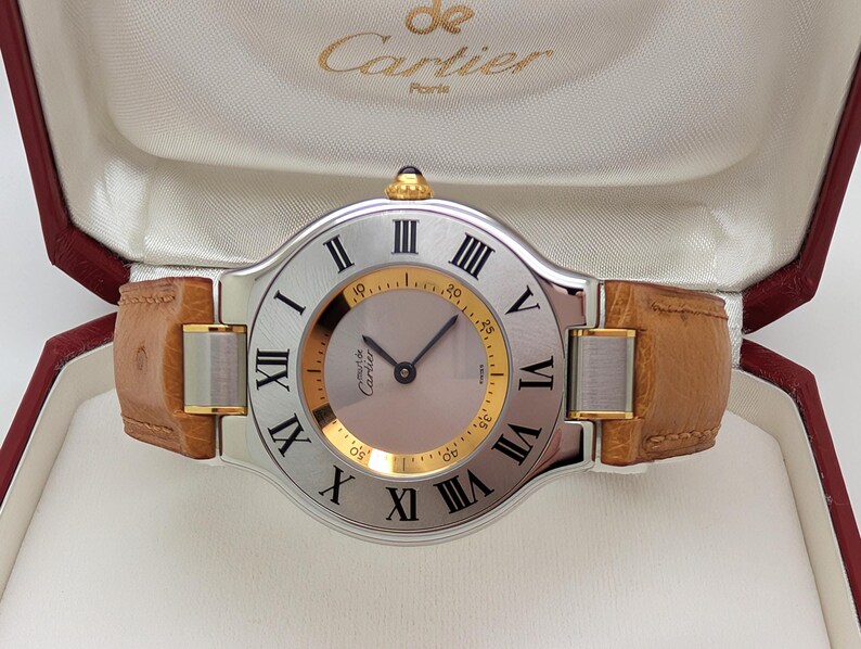 CARTIER WATCH the Must 21 model 33mm Steel + 18kt Yellow Gold w Quartz Movement + Ostrich Leather Strap comes w Cartier Warranty + Watch Box