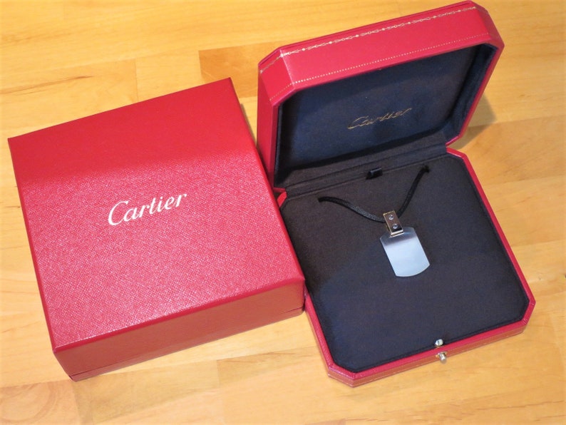 Santos Dog Tag pendant in Cartier red box.