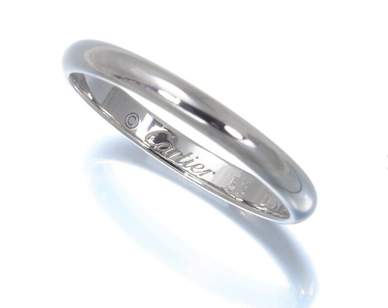 Hallmarks inside Cartier wedding ring.