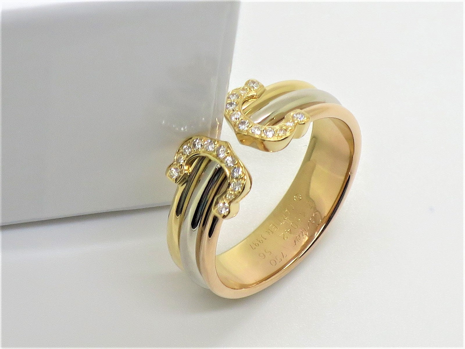 CARTIER, A DIAMOND ENTRELACES C RING in 18ct white gold,… | Drouot.com