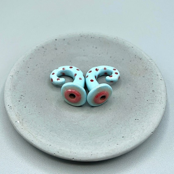 0 gauge ceramic earrings approximately 8mm. Blue with red polka dots